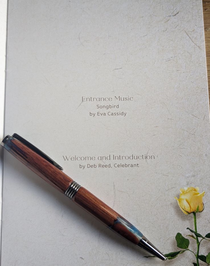 Deb Reed Celebrant Colchester Essex. A charm pinned to a tree at a funeral ashes internment.