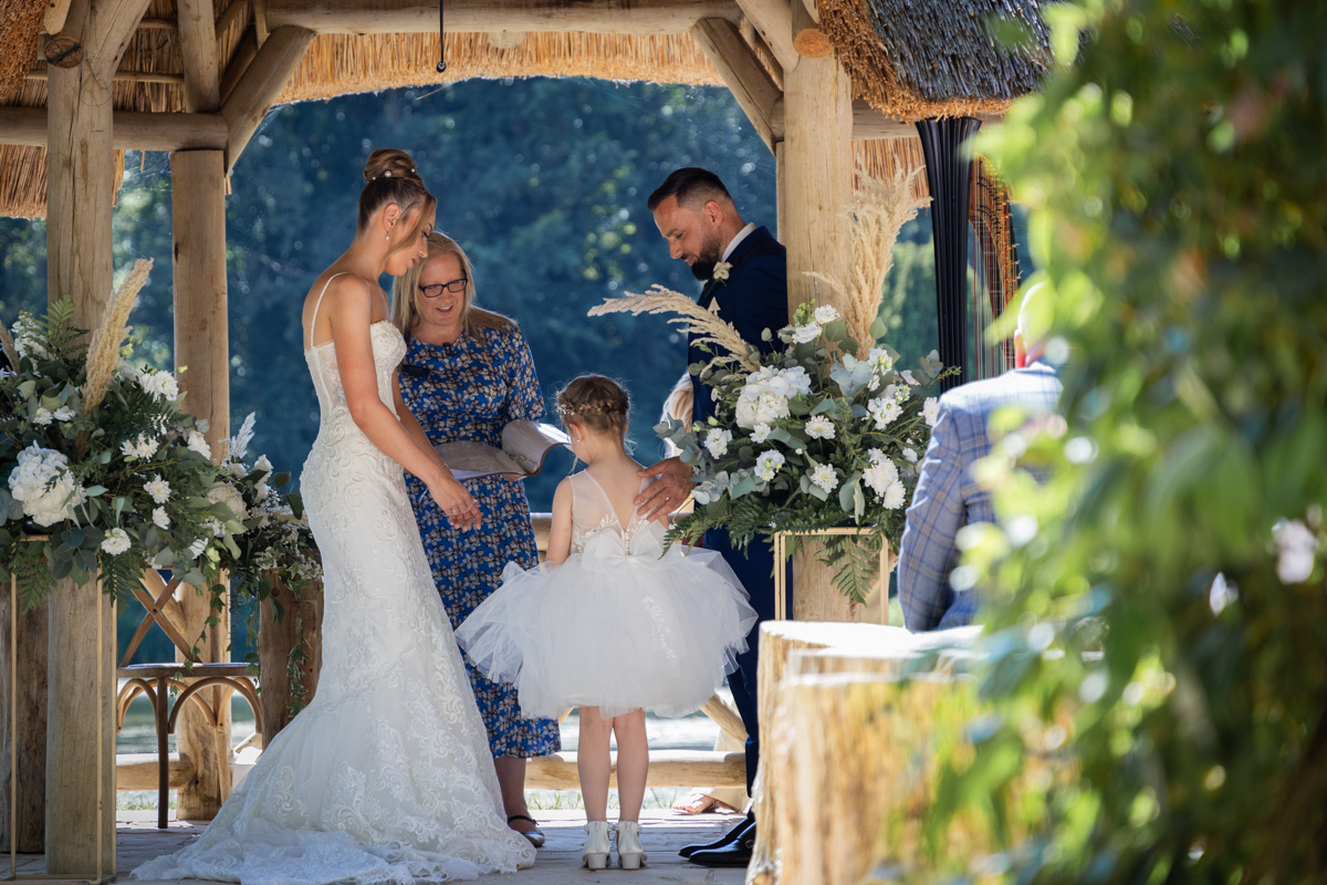 Deb Reed Celebrant Colchester Essex, performing the ceremony at Chaney and Alberts wedding with their daughter.