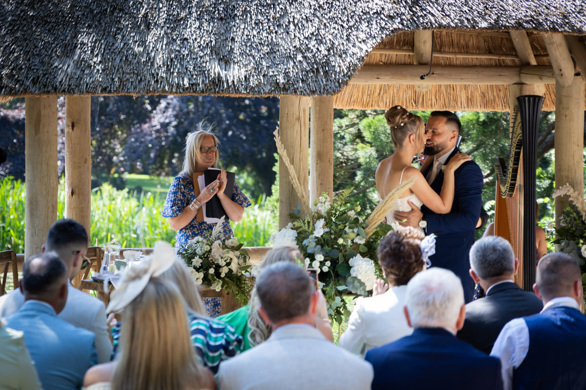 Deb Reed Celebrant Colchester Essex, watching the first kiss at Chaney and Alberts wedding.