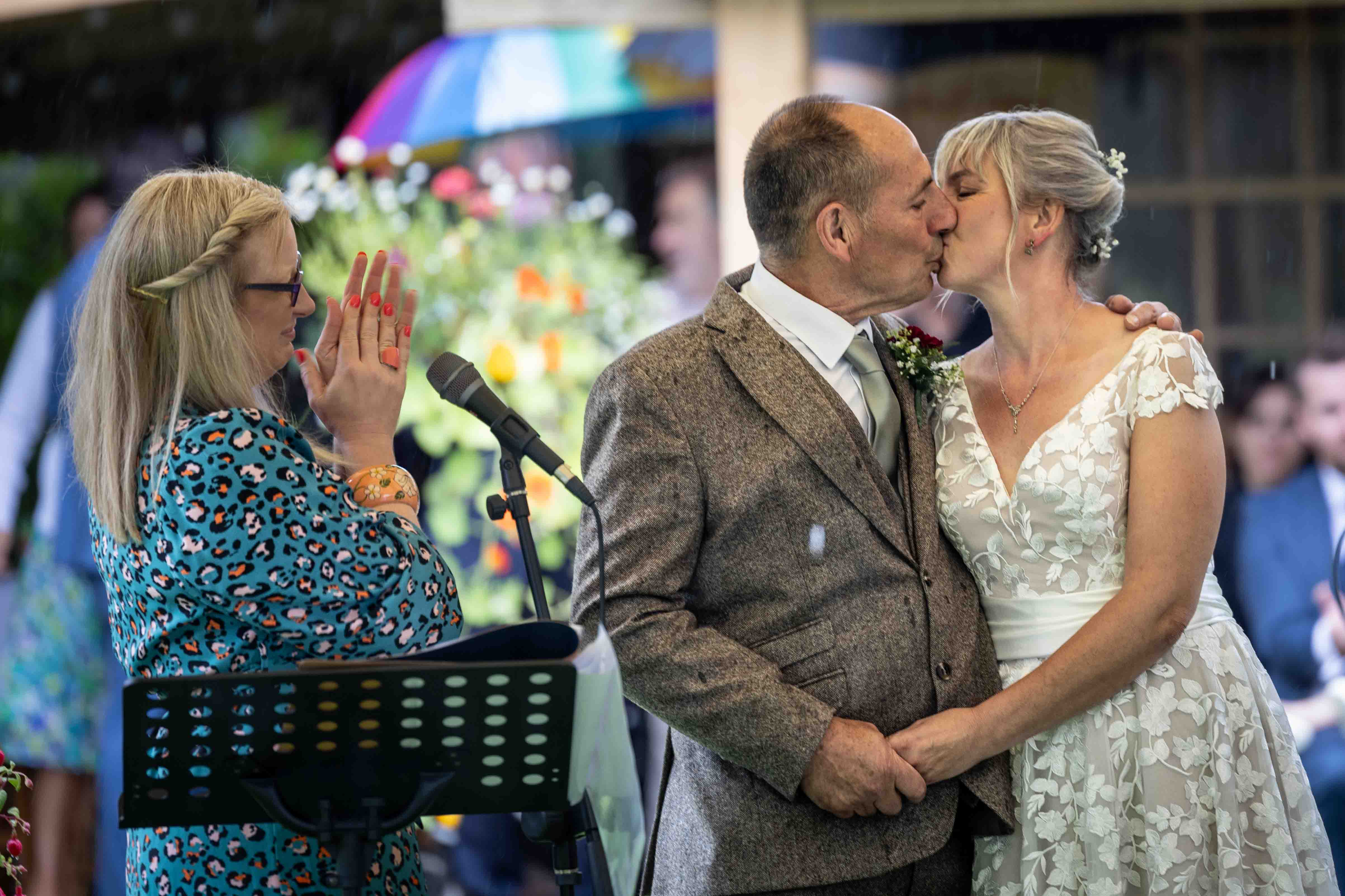 Deb Reed Celebrant Colchester Essex, watching the first kiss at Gary and Annette's wedding.