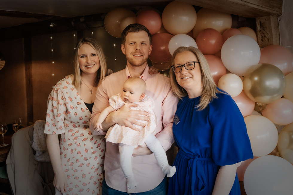 Deb Reed Celebrant Colchester Essex, posing for a photo with Lauren and Dan at Lyla's Naming.