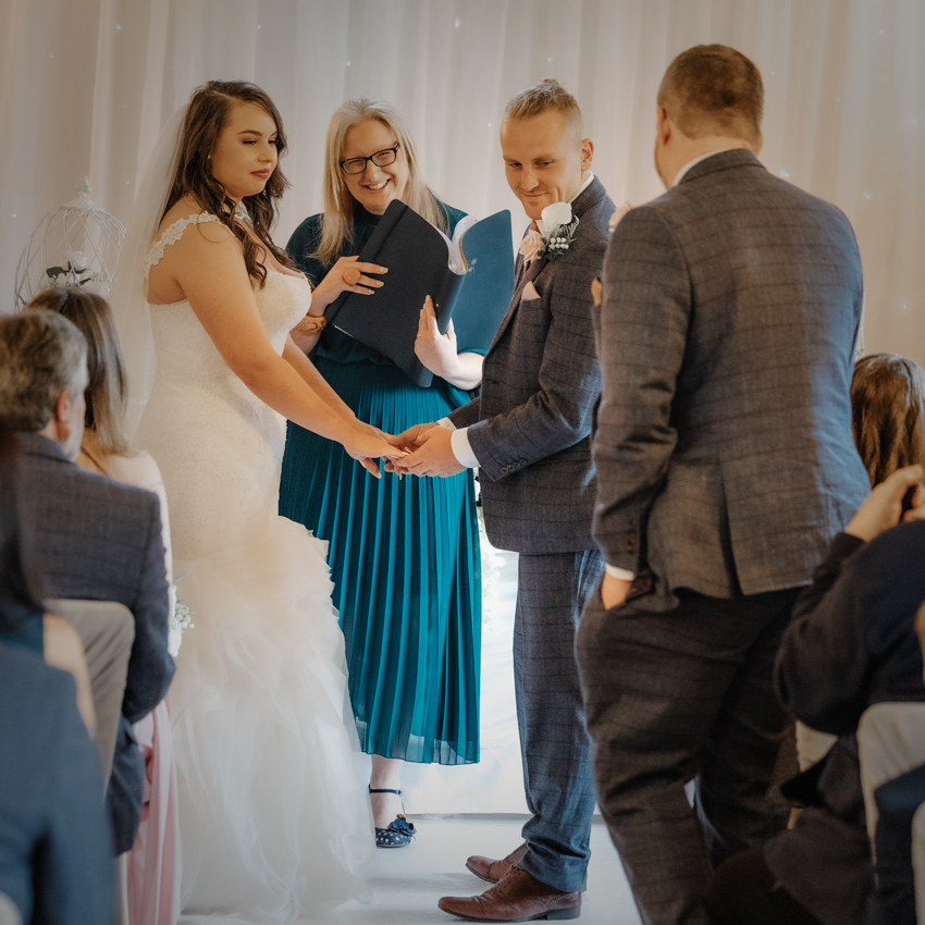 Deb Reed Celebrant Colchester Essex, smiling at their son at Rachael and Lukes wedding.