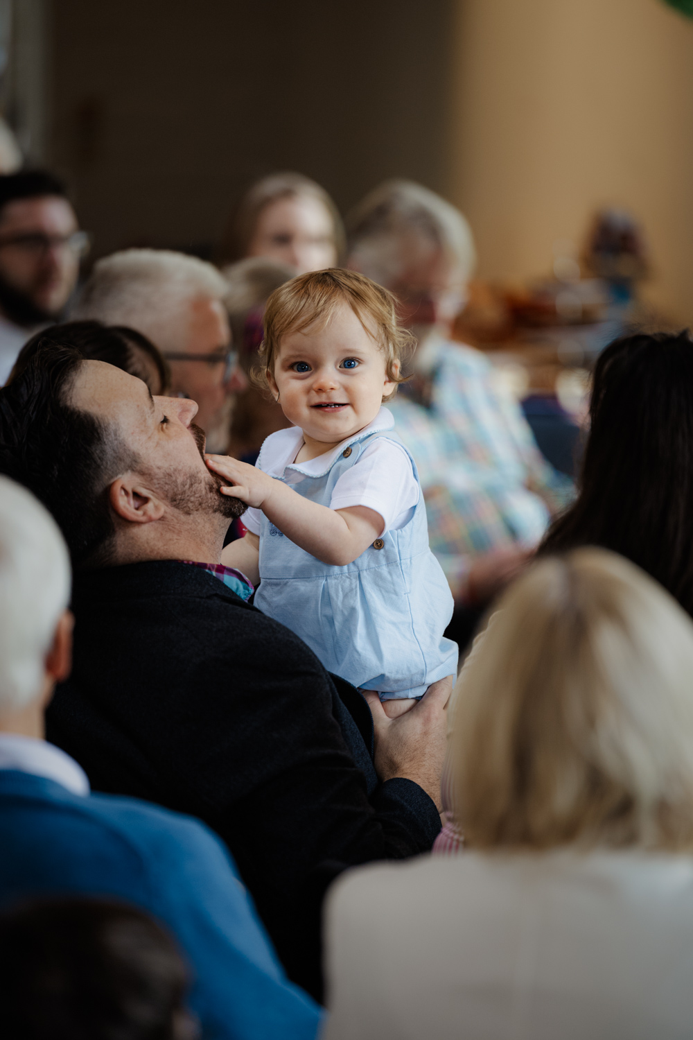 Deb Reed Celebrant Colchester Essex, Sebastian looking at the camera with his Dad at Sebastian's naming ceremony.