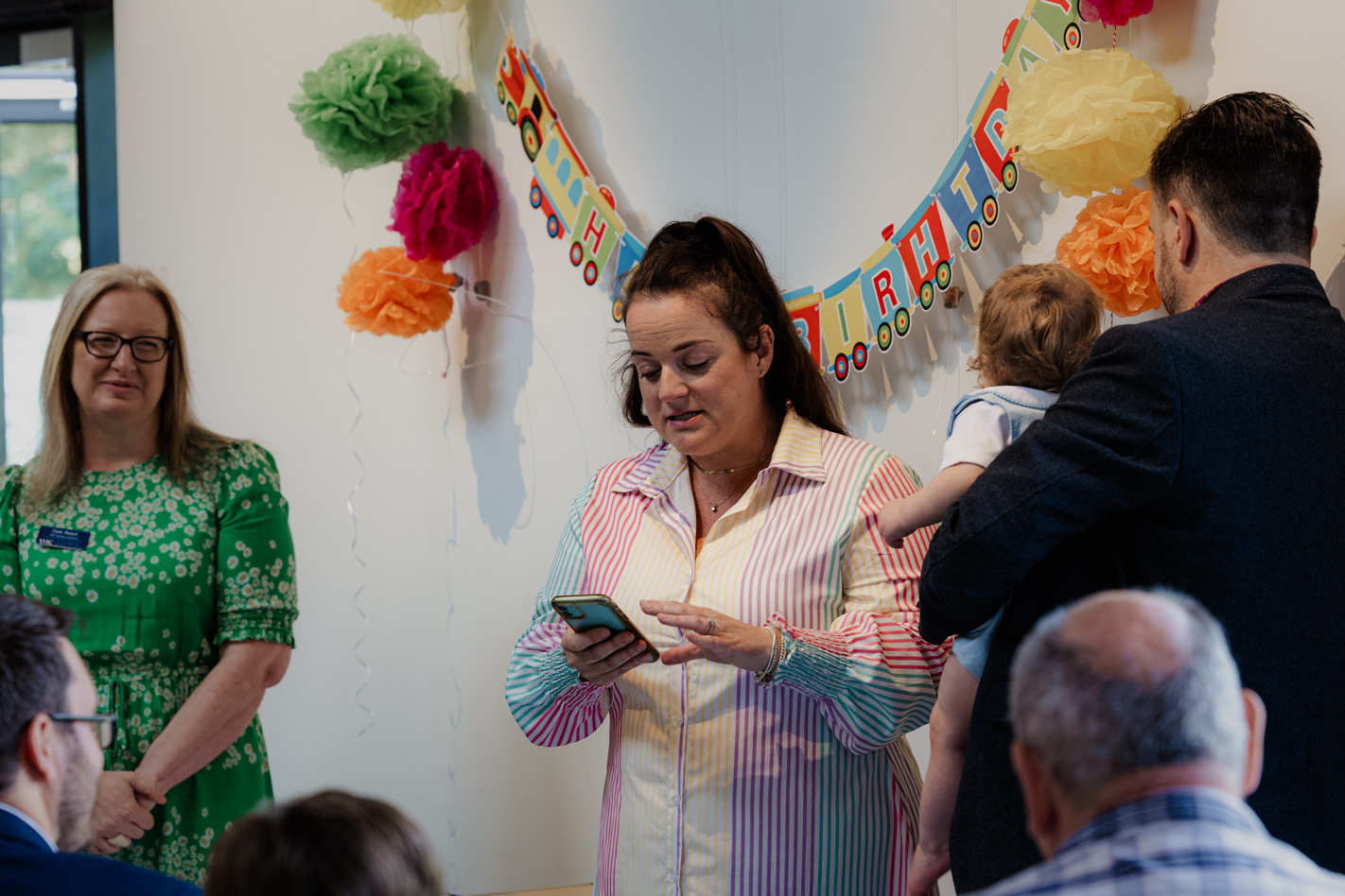 Deb Reed Celebrant Colchester Essex, watching on while Sebastian's Mum speaks at Sebastian's naming ceremony.